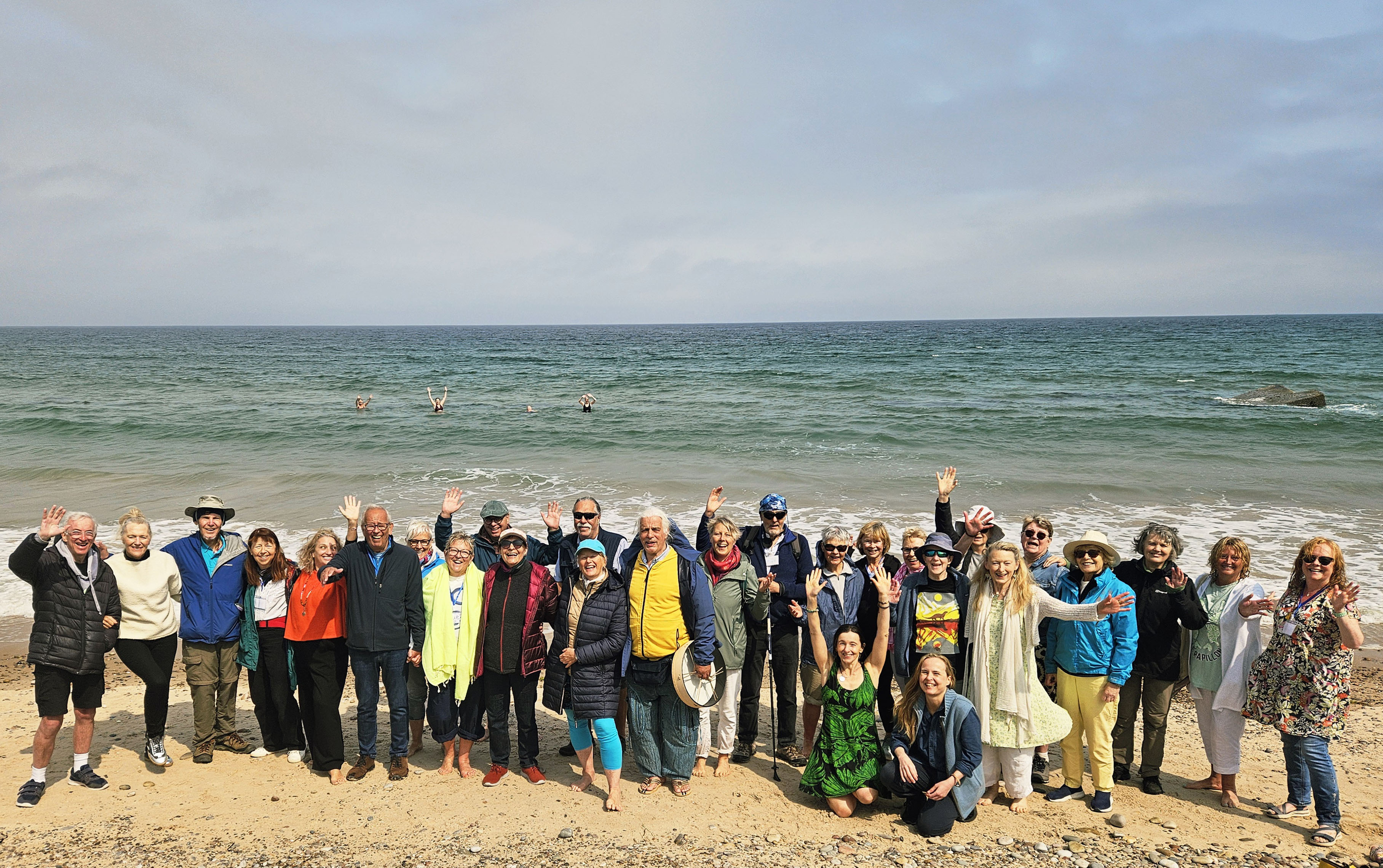 Homecoming in Song & Stillness group shot on Findhorn beach